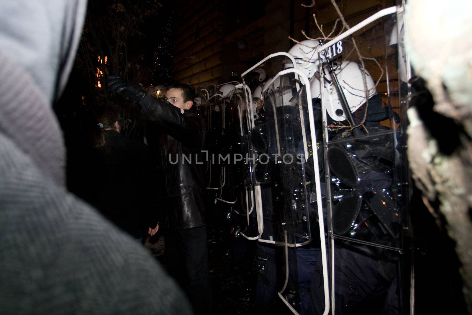 Agresive crowd and police near Latvian Parliament. Riga, Latvia, January 13, 2009