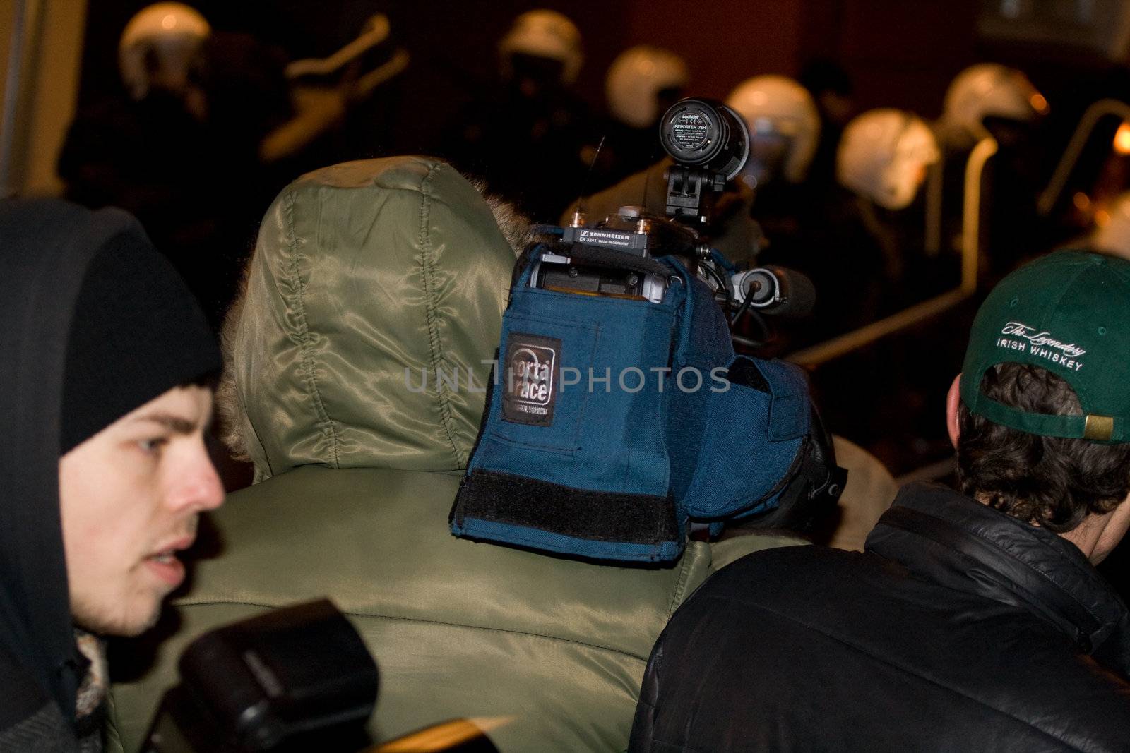 Agresive crowd and police near Latvian Parliament. Riga, Latvia, January 13, 2009