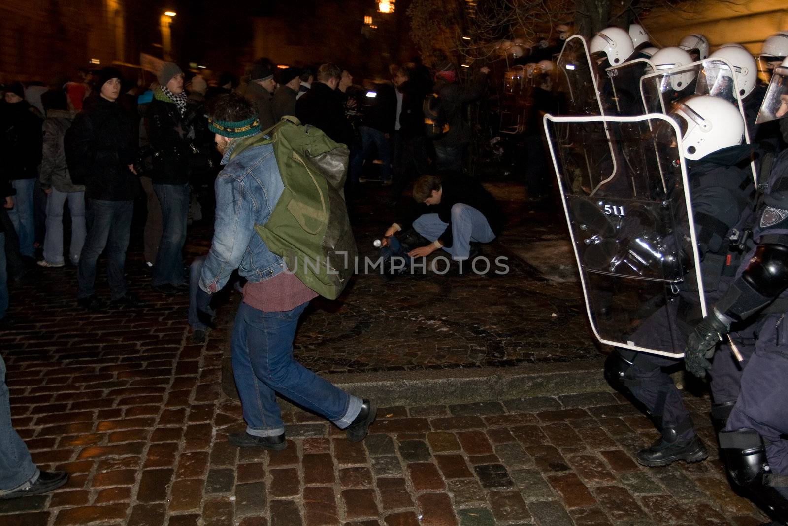 Agresive crowd and police near Latvian Parliament. Riga, Latvia, January 13, 2009