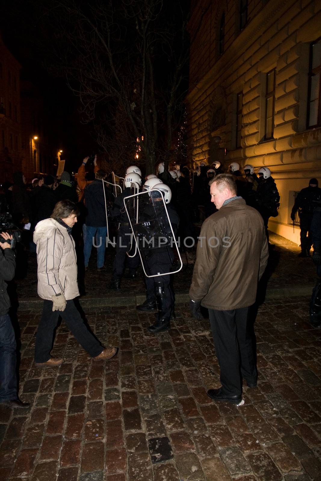 Agresive crowd and police near Latvian Parliament. Riga, Latvia, January 13, 2009