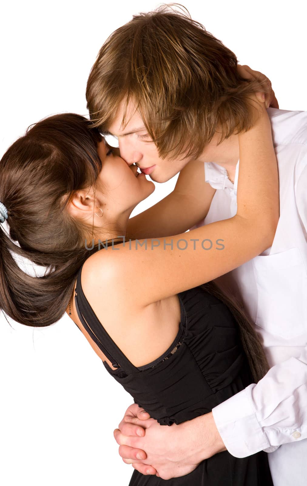 Young beautiful couple kissing isolated on white