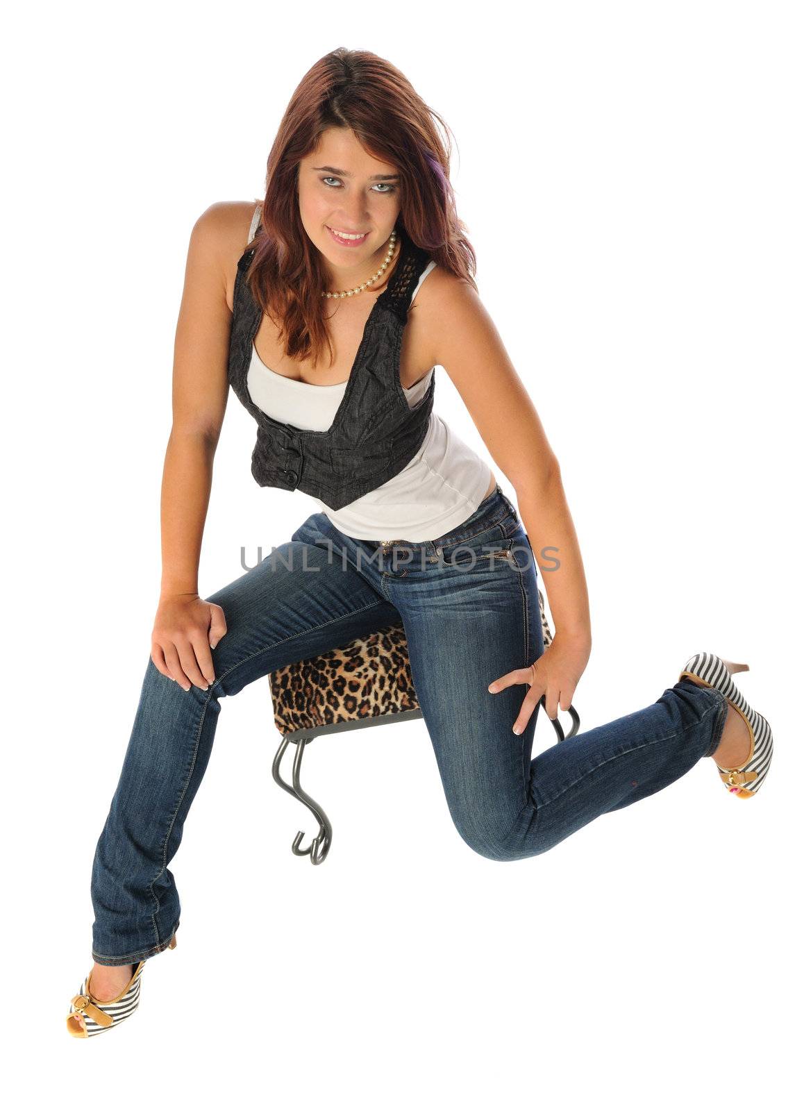 attractive young woman on a stool set on a white background