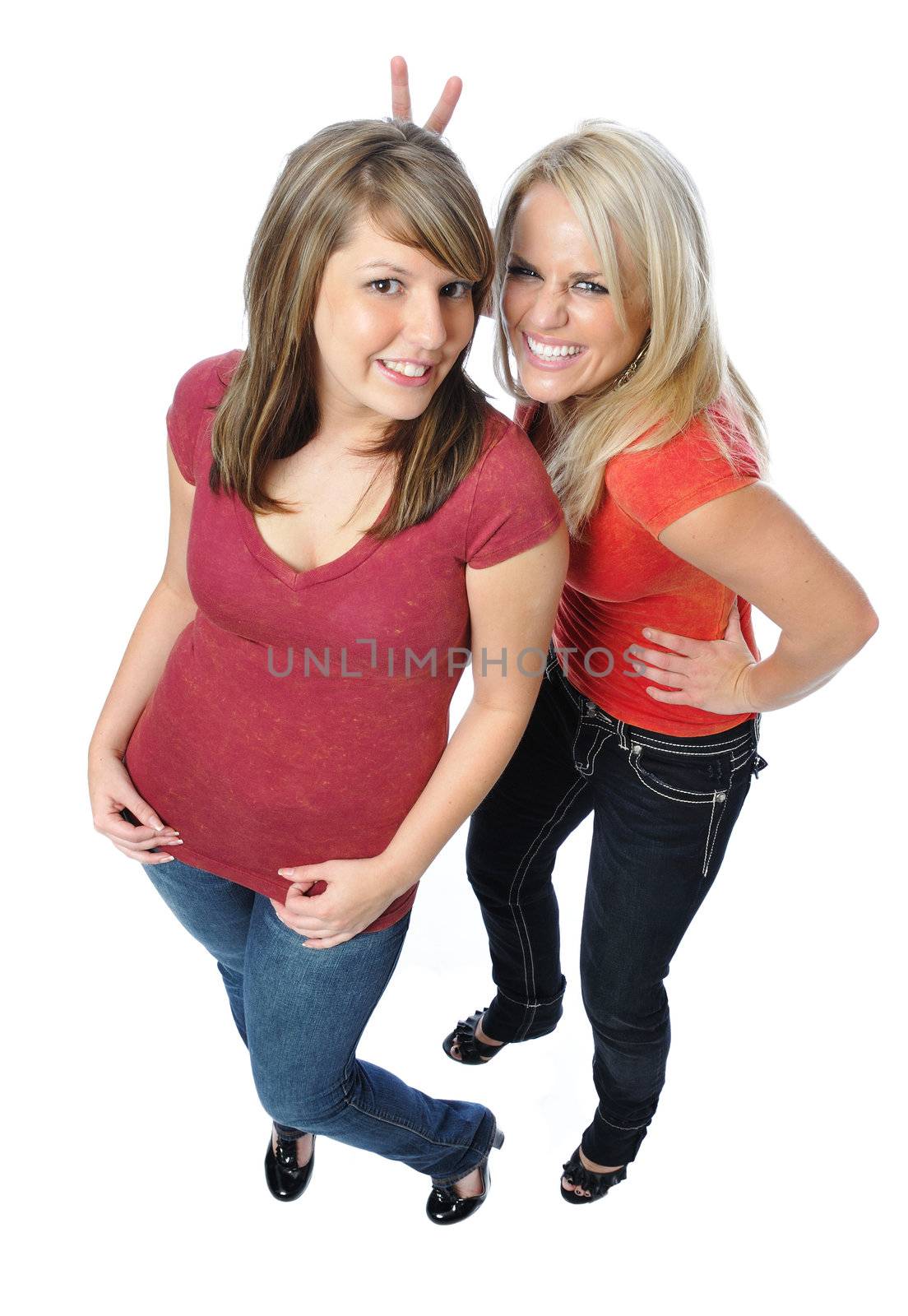 two friends posing together on a white background