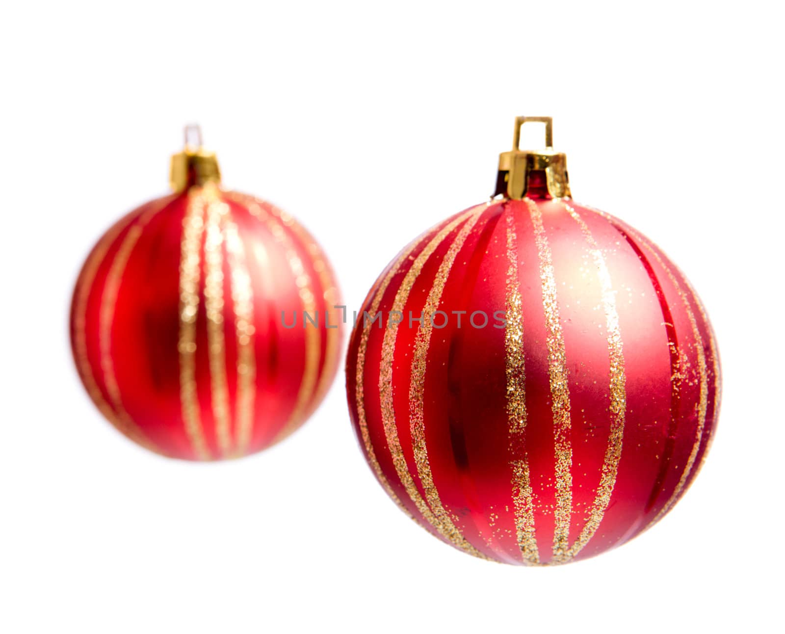 Two red Christmas balls isolated on white