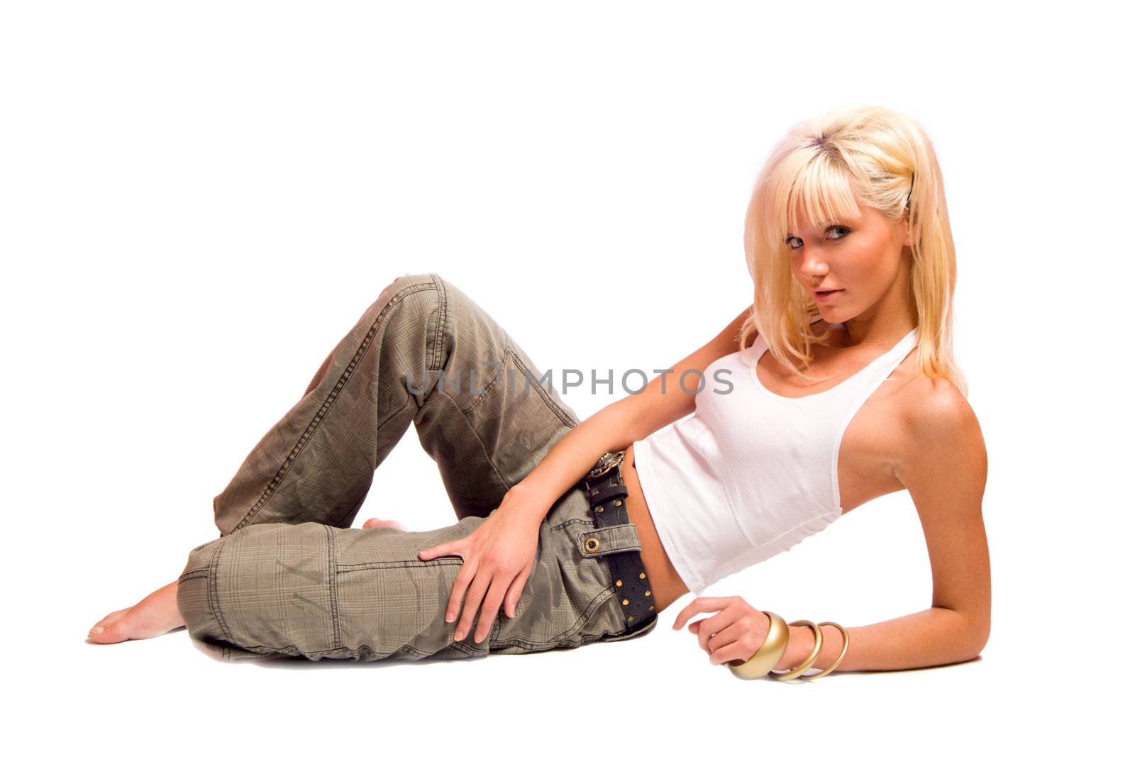 Beautiful young woman lying on the floor isolated on white