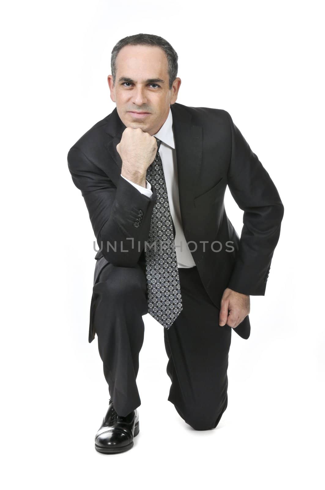 Thinking businessman in a suit isolated on white background