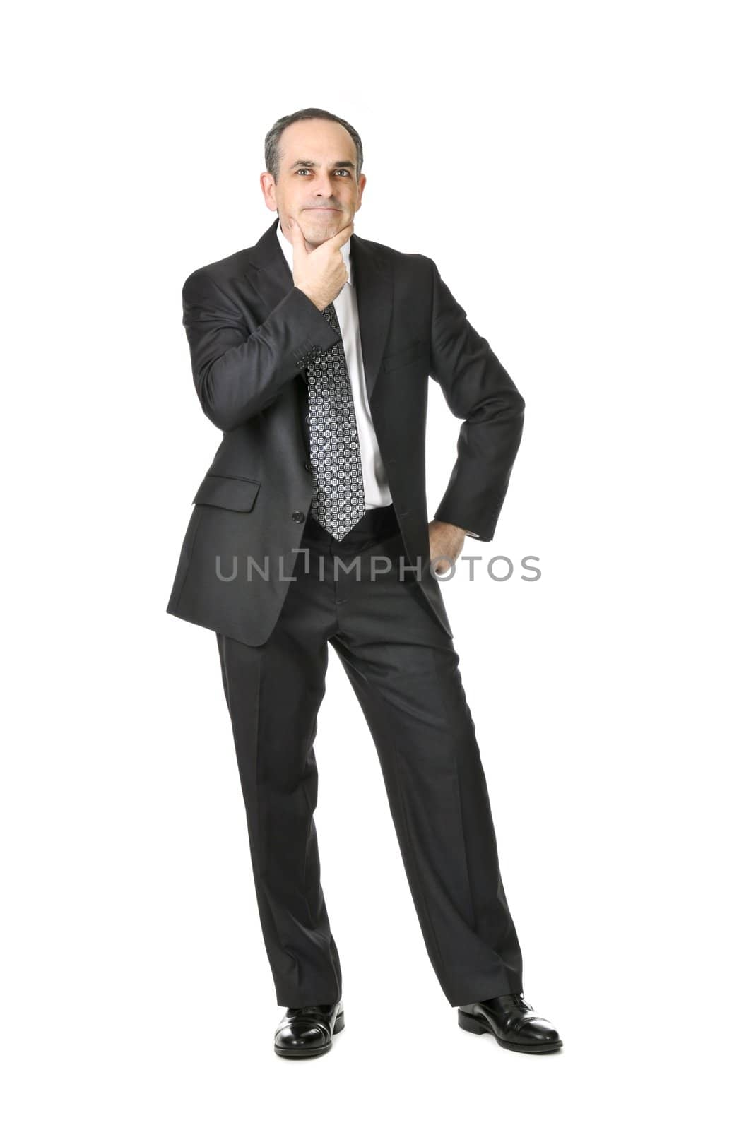 Thinking businessman in a suit isolated on white background