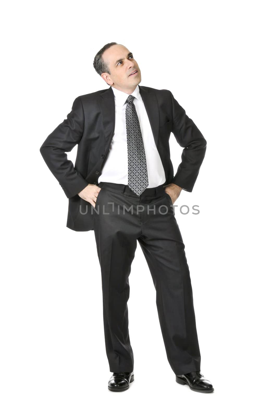 Thinking businessman in a suit isolated on white background