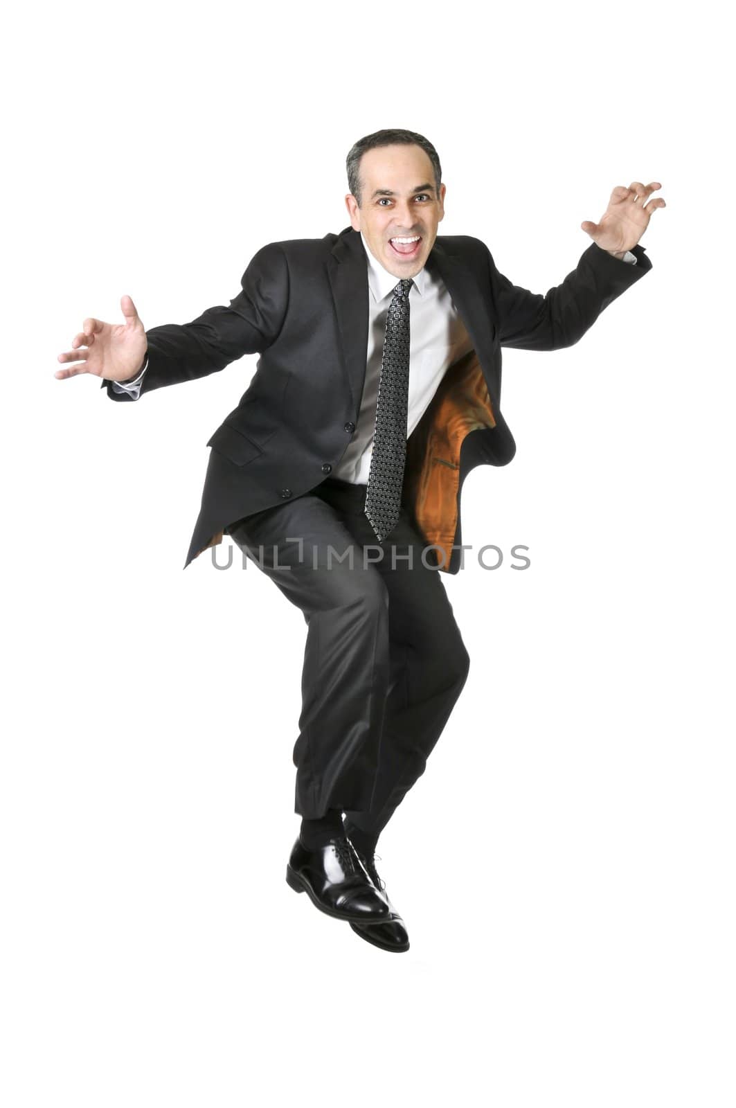 Jumping businessman in a suit isolated on white background