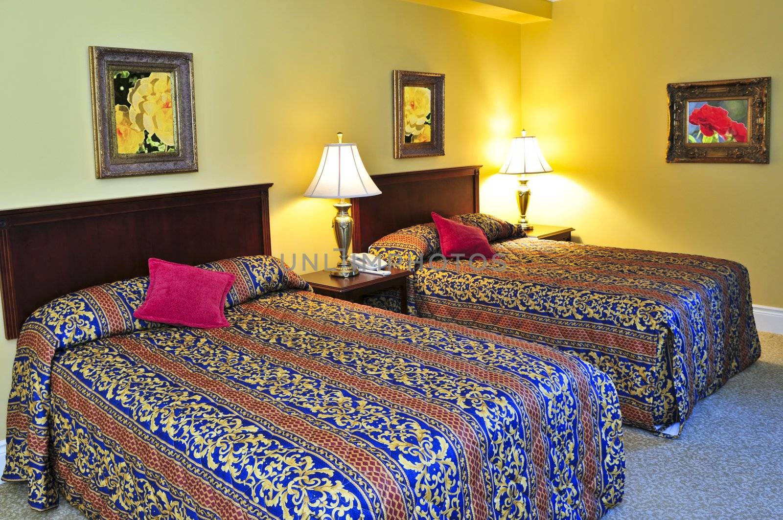 Bedroom interior with two double beds, images on the wall are my own.