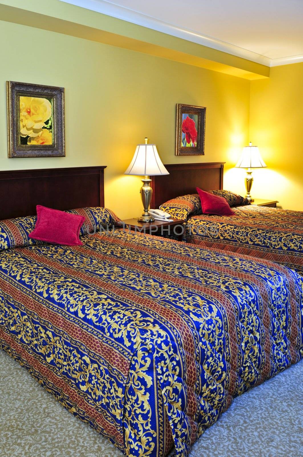 Bedroom interior with two double beds, images on the wall are my own.