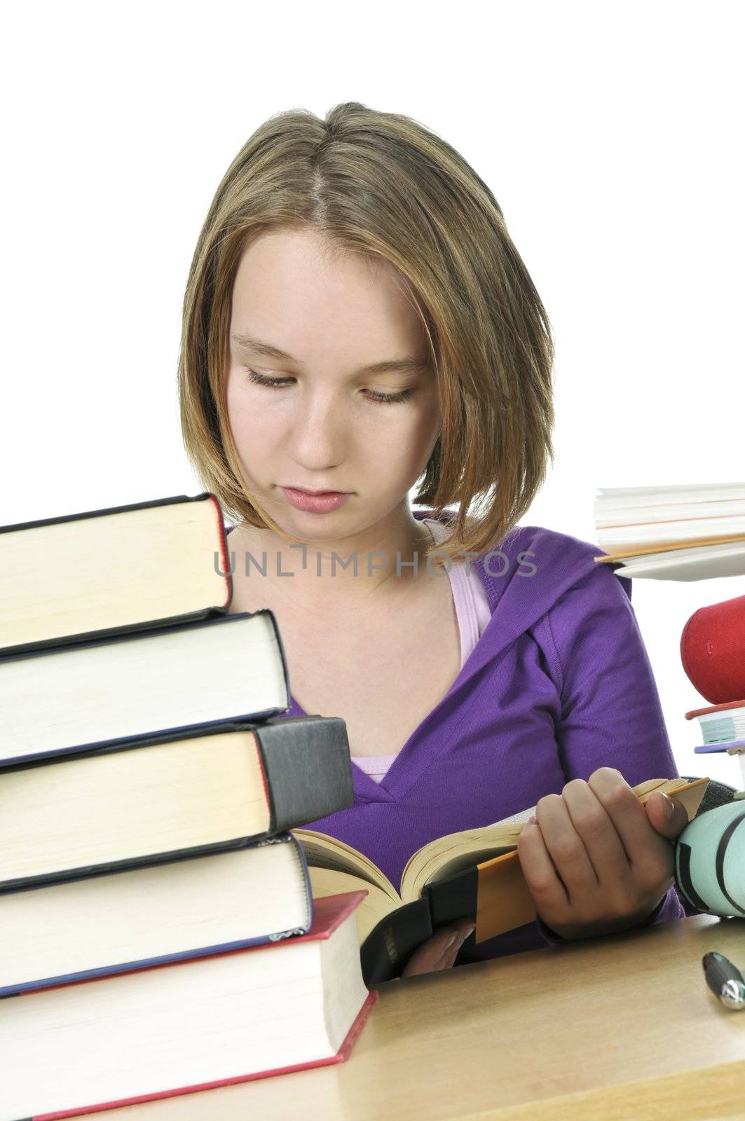 Teenage school girl studying at the desk