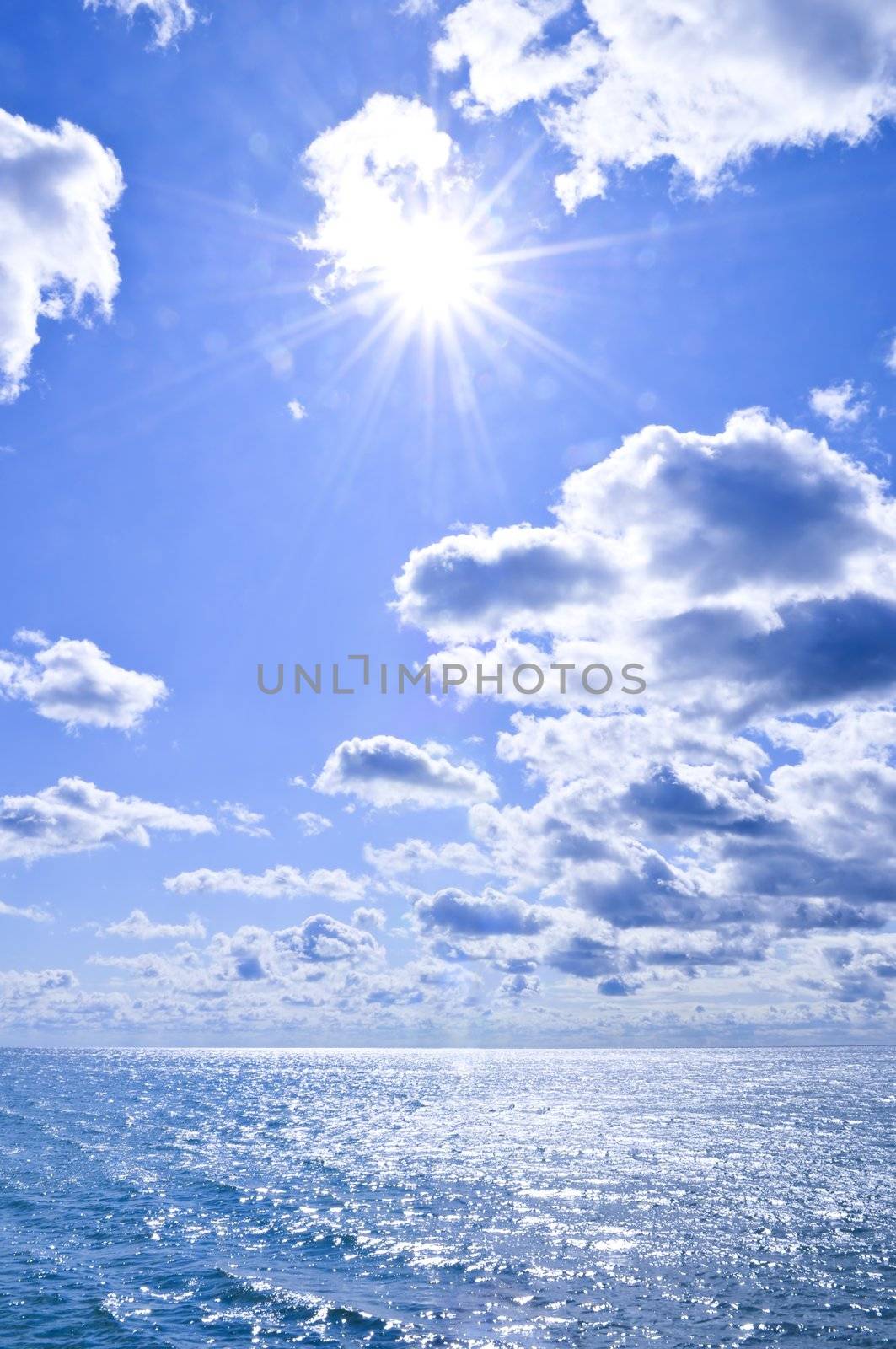 Blue ocean water and sunny sky background