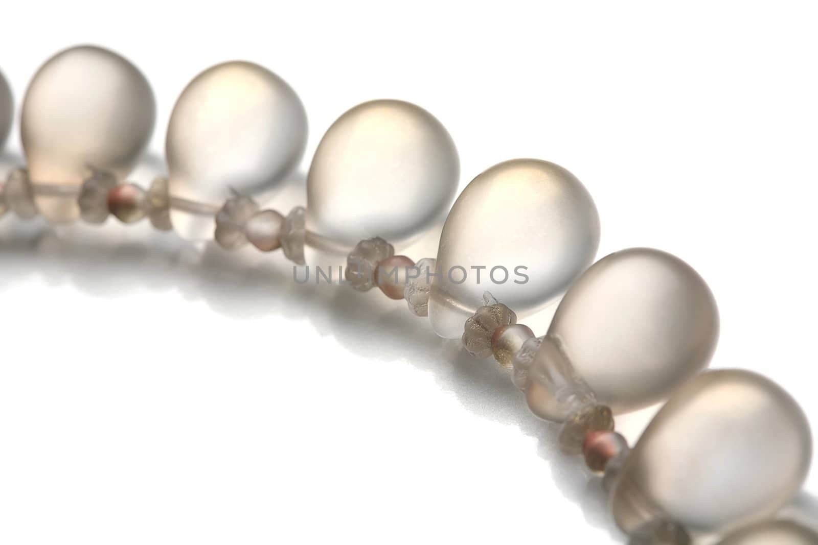 Fragment of the luxurious necklace, translucent beads to look like dripped