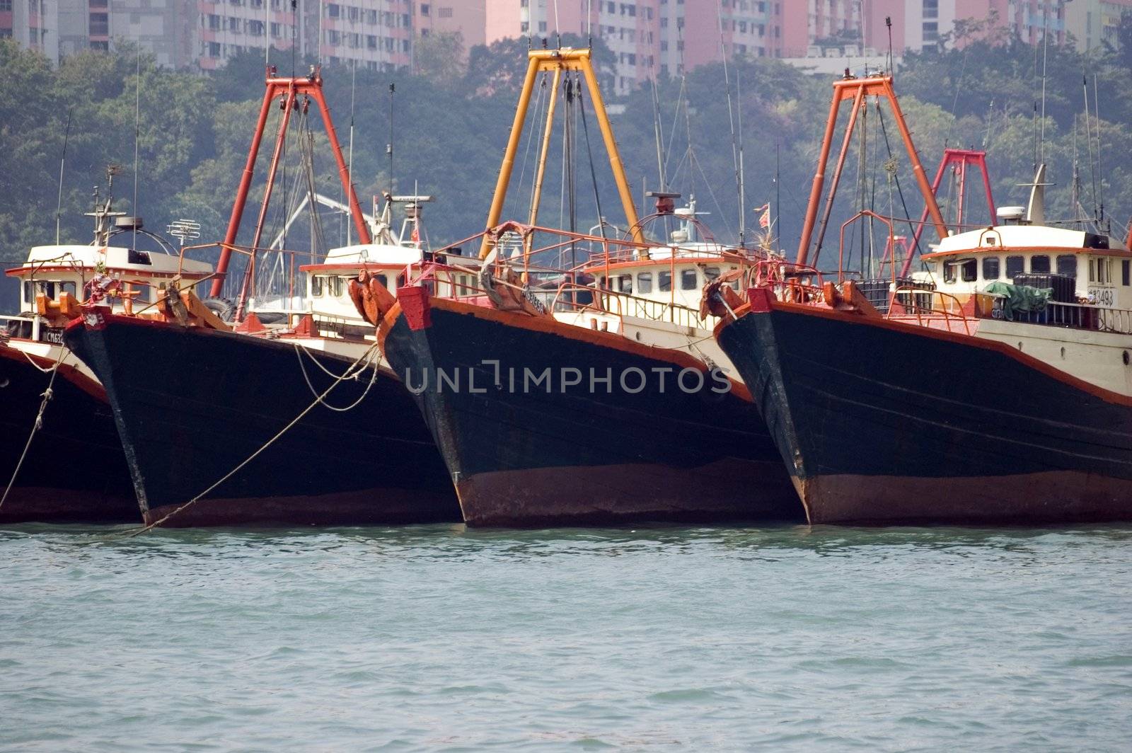 Medium size vessels waiting in Hongkong, Aberdeen harbour. Ships holding for departure.