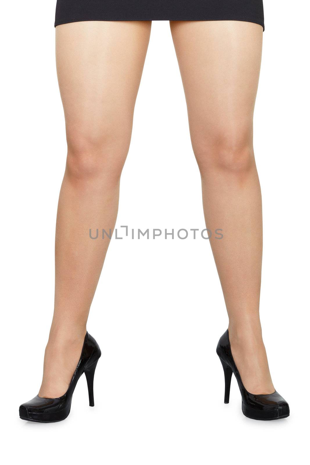 Widely spaced female legs on white background