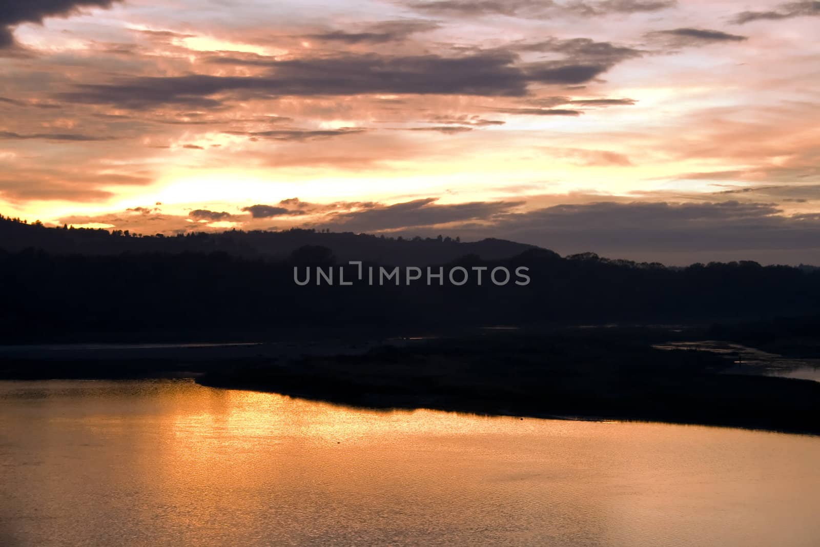 A golden sunset over the river