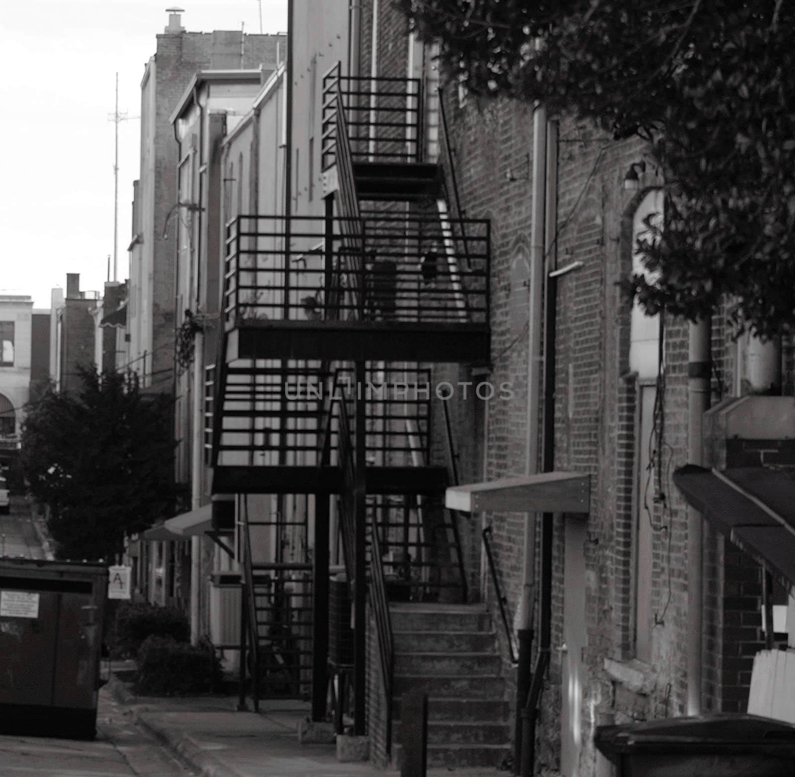 An urban back alley in shown in black and white
