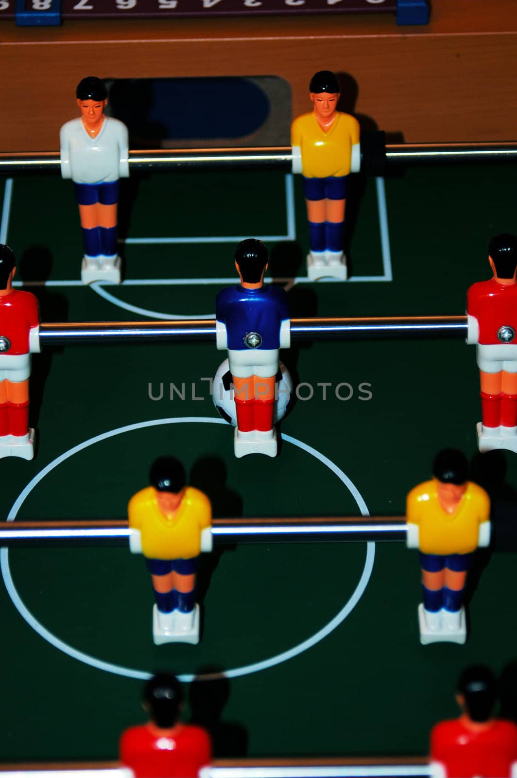 A shot lined up on a foosball table