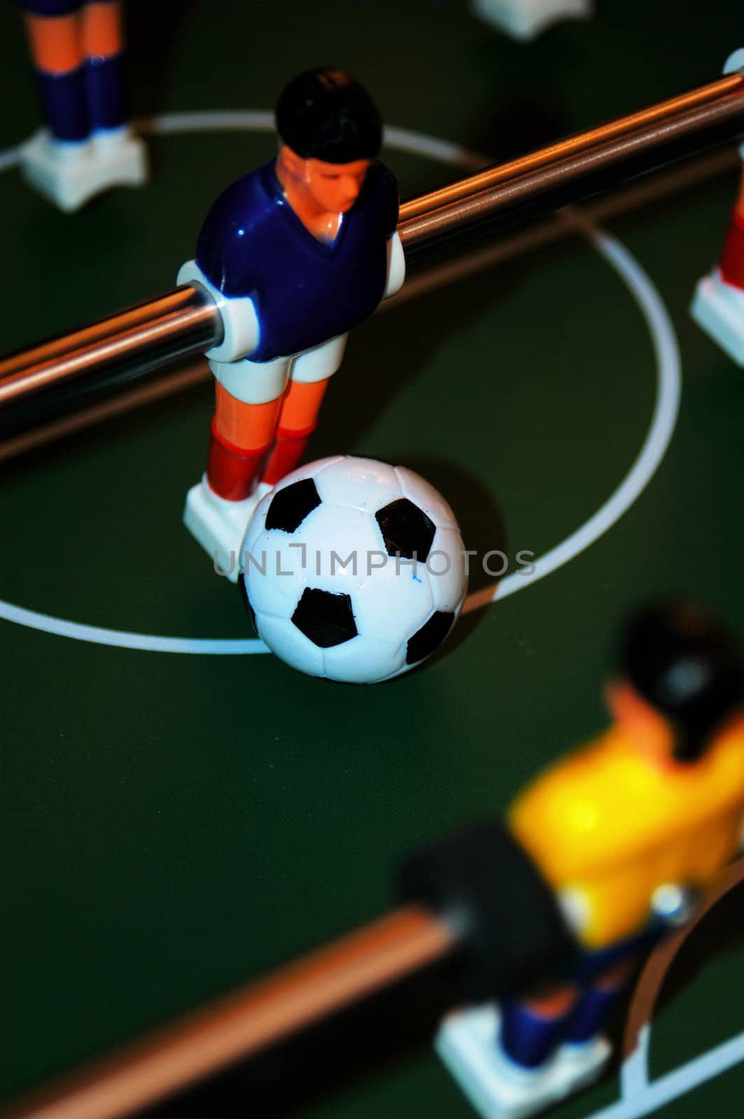 man in a blue top on a foosball game