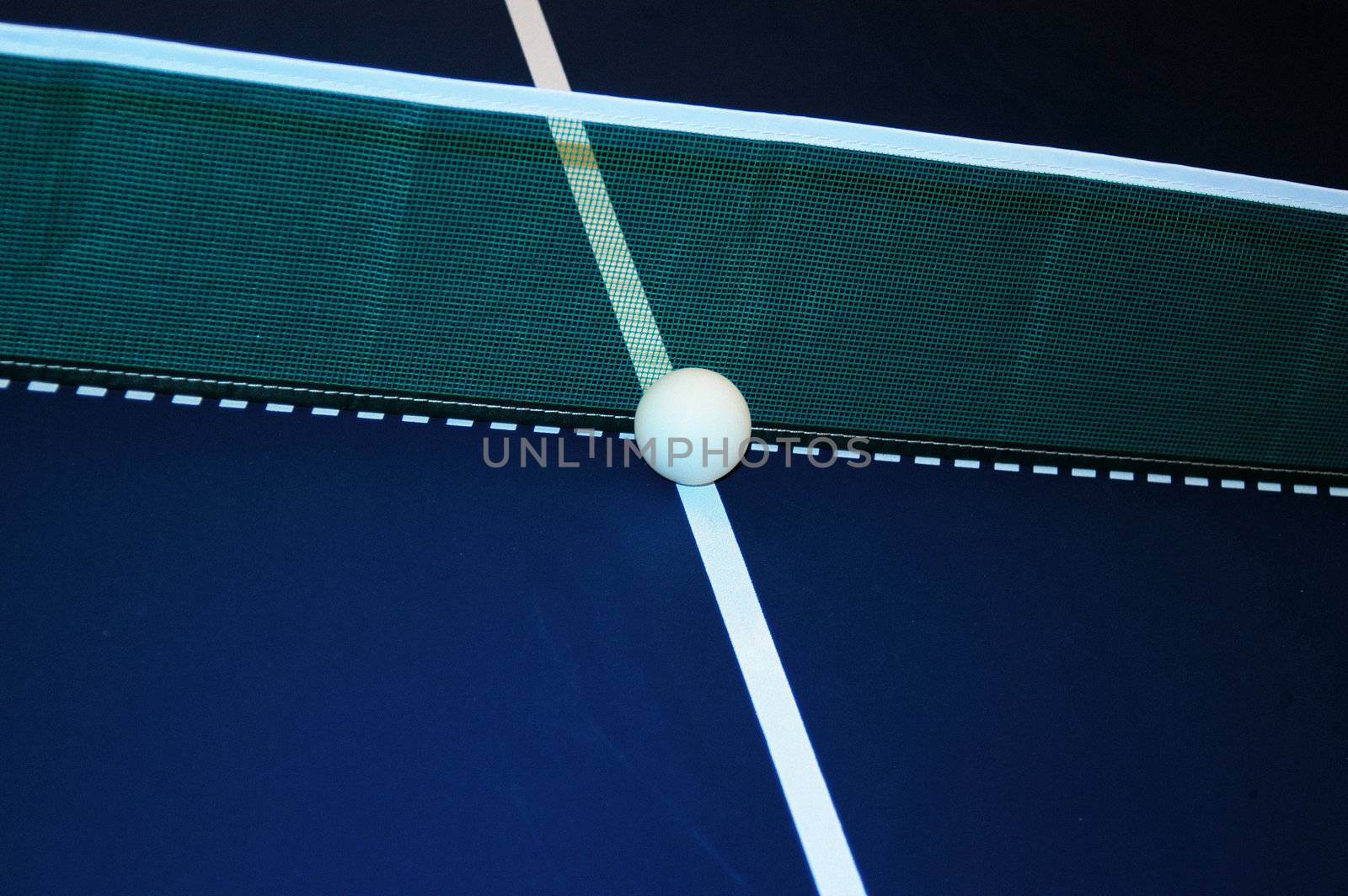 ball at the net on a ping pong table