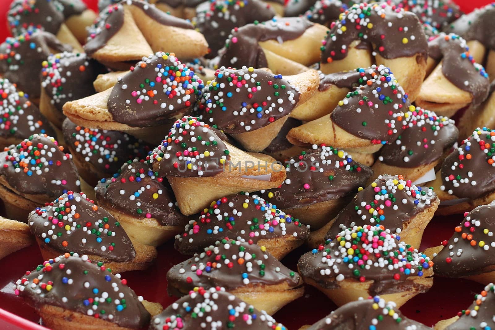 shot of chocolate covered fortune cookies upclose by creativestock