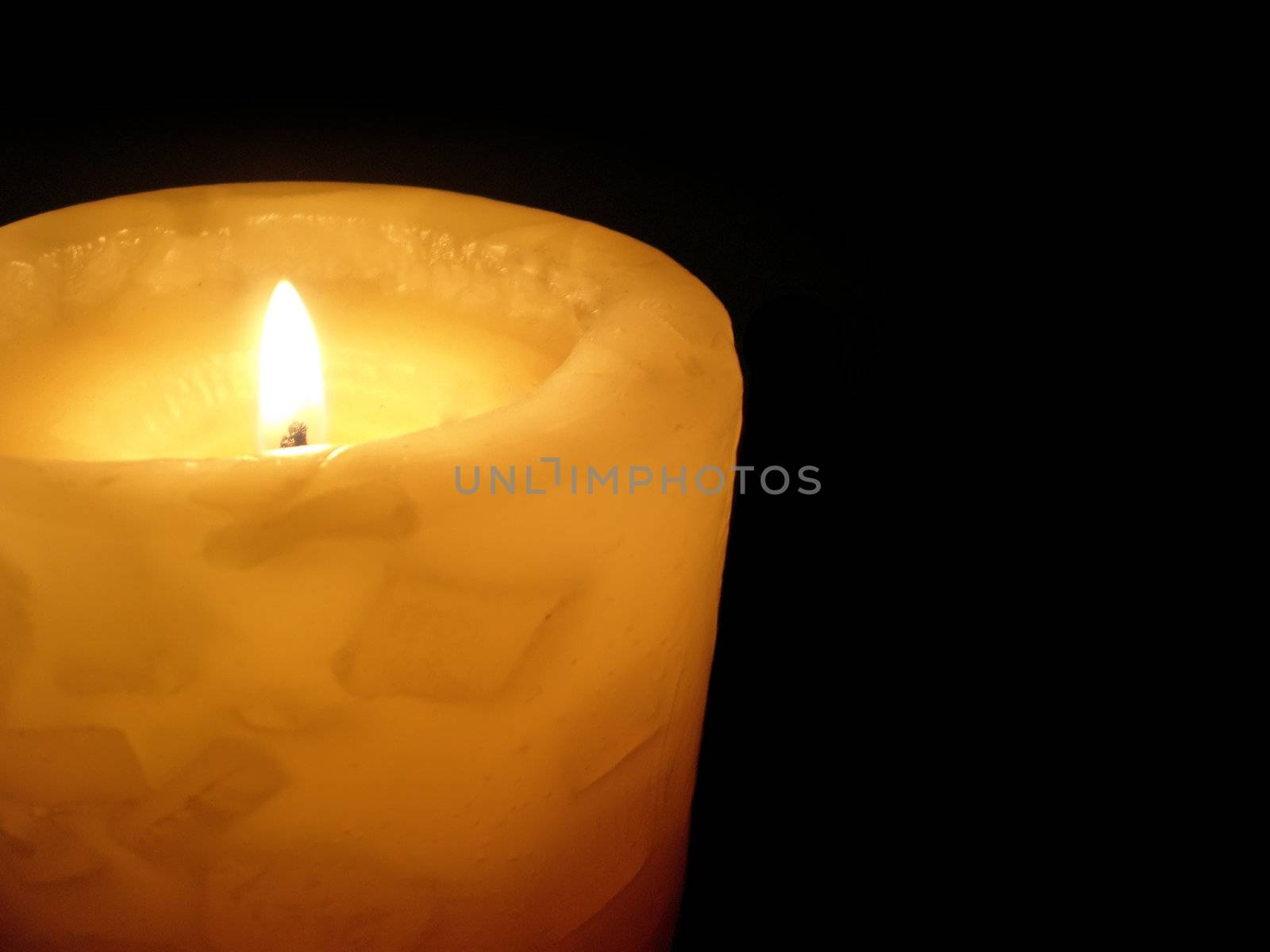 soft candle light on black background