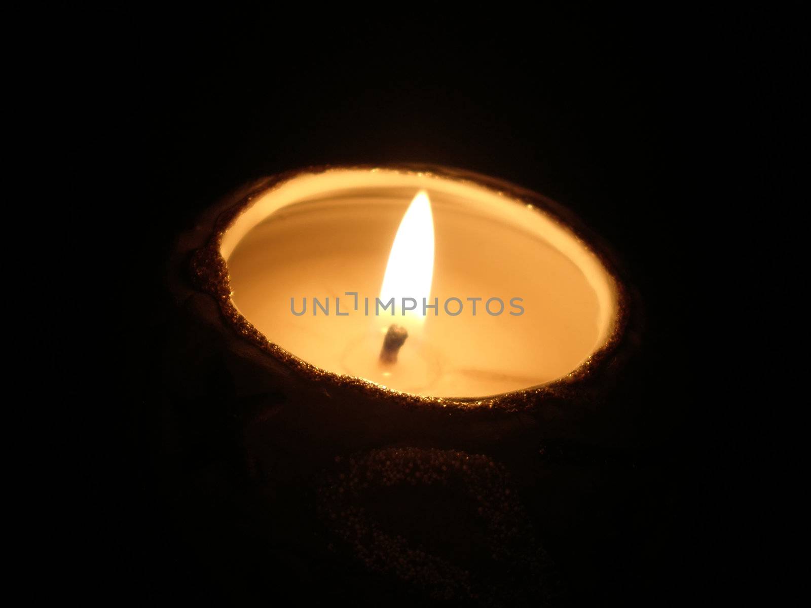 soft candle light on black background