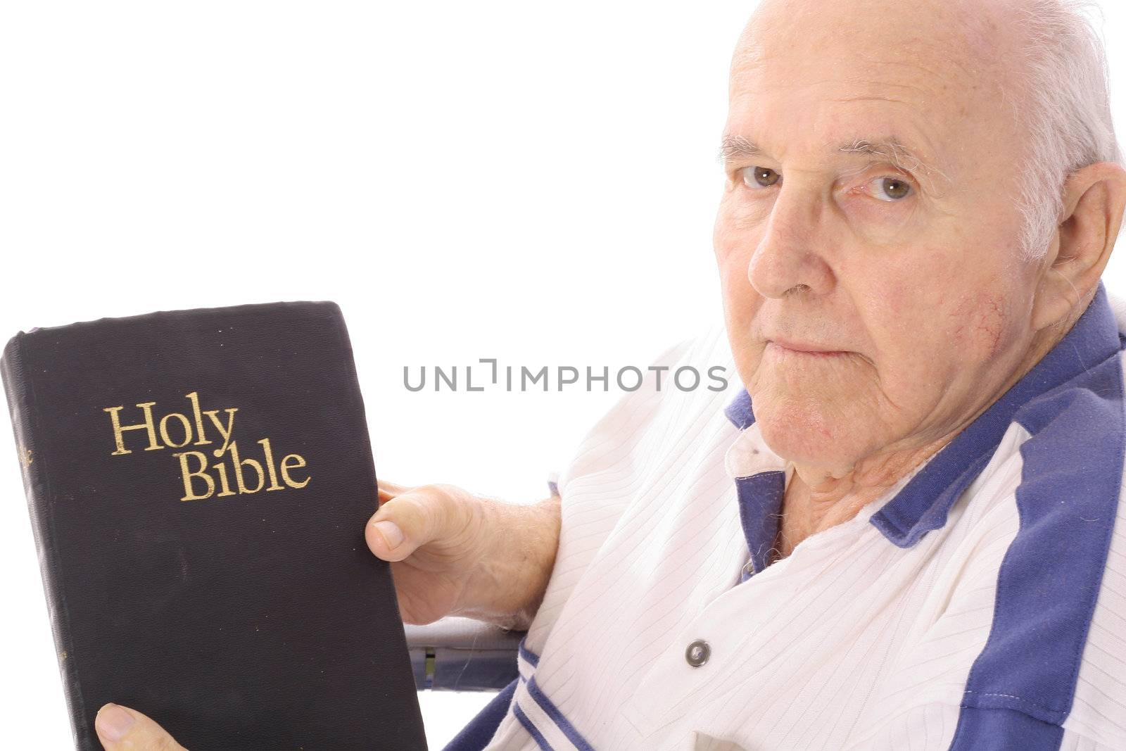shot of a grandfather with a bible by creativestock