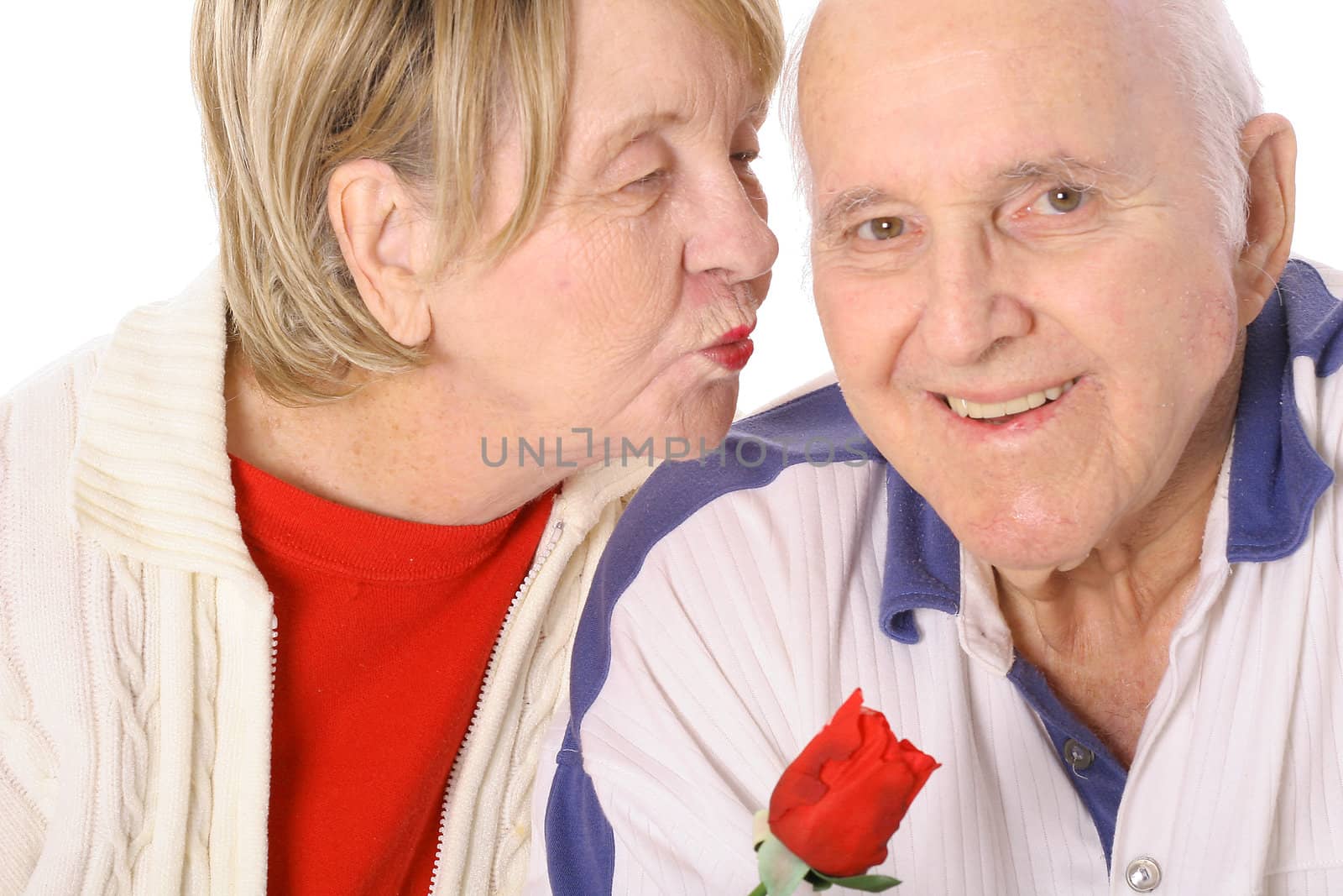 shot of a seniors valentines kiss by creativestock