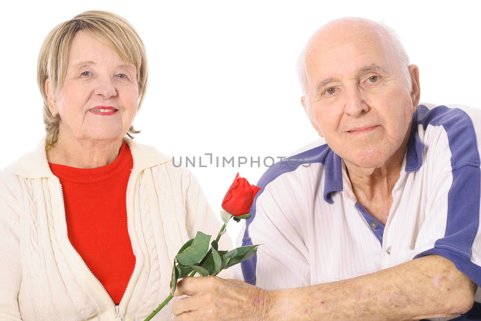 shot of a Happy seniors with Valentines rose by creativestock