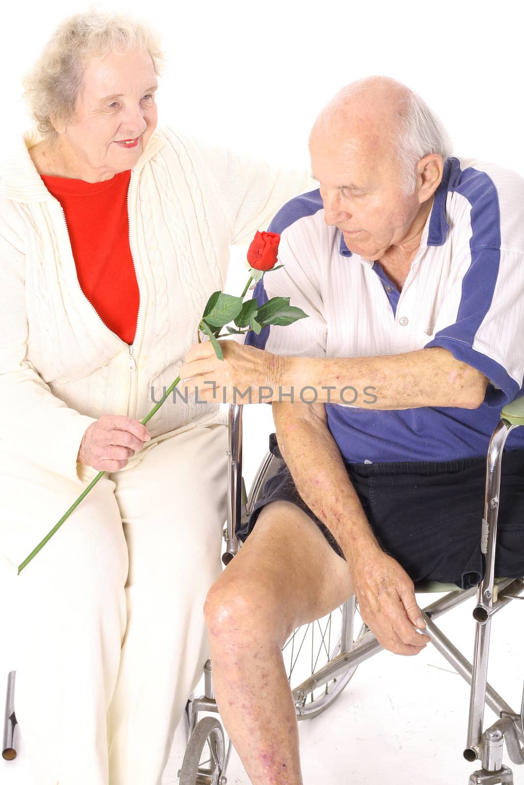 wife giving handicap husband a rose vertical