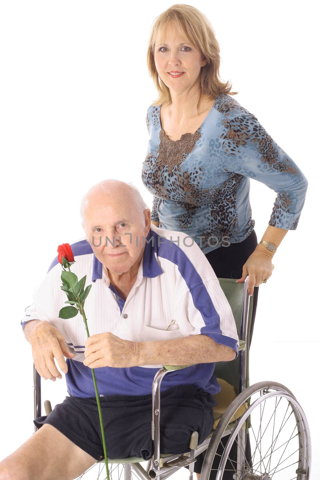 shot of a handicap elderly man with younger woman by creativestock