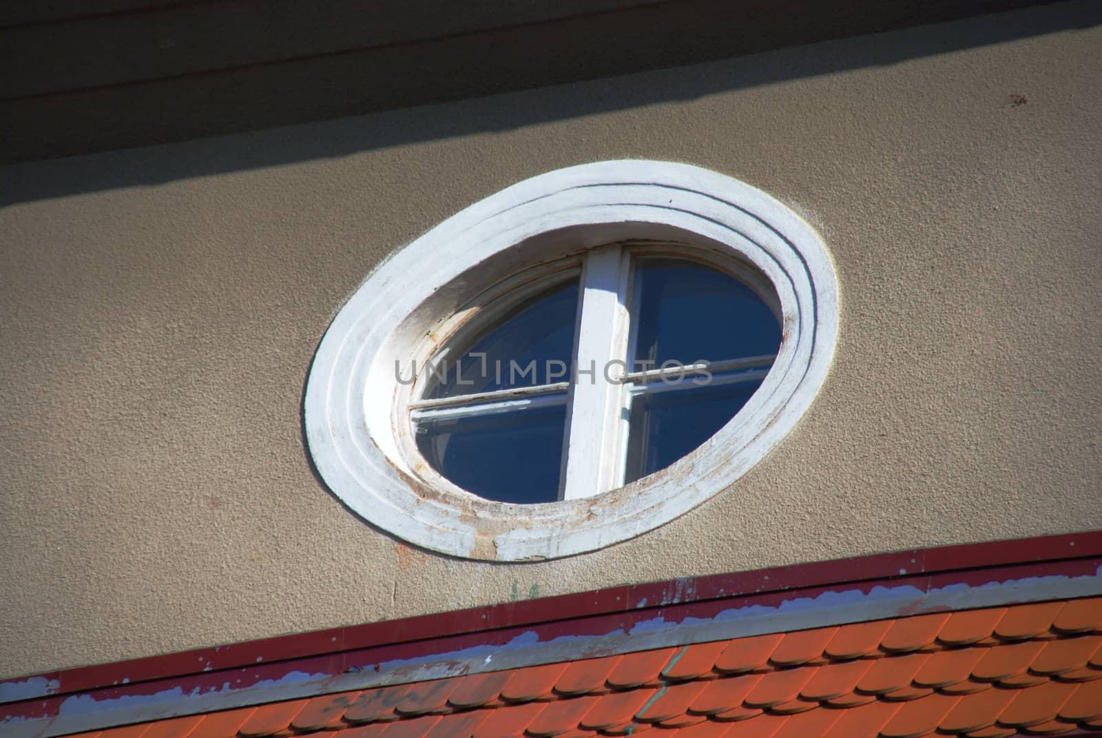 Round window in the building of multi-family. by wojciechkozlowski