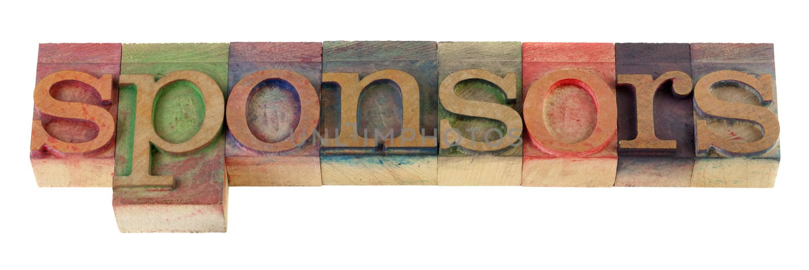 the sponsors word in vintage wooden letterpress type blocks, stained by color ink, isolated on white