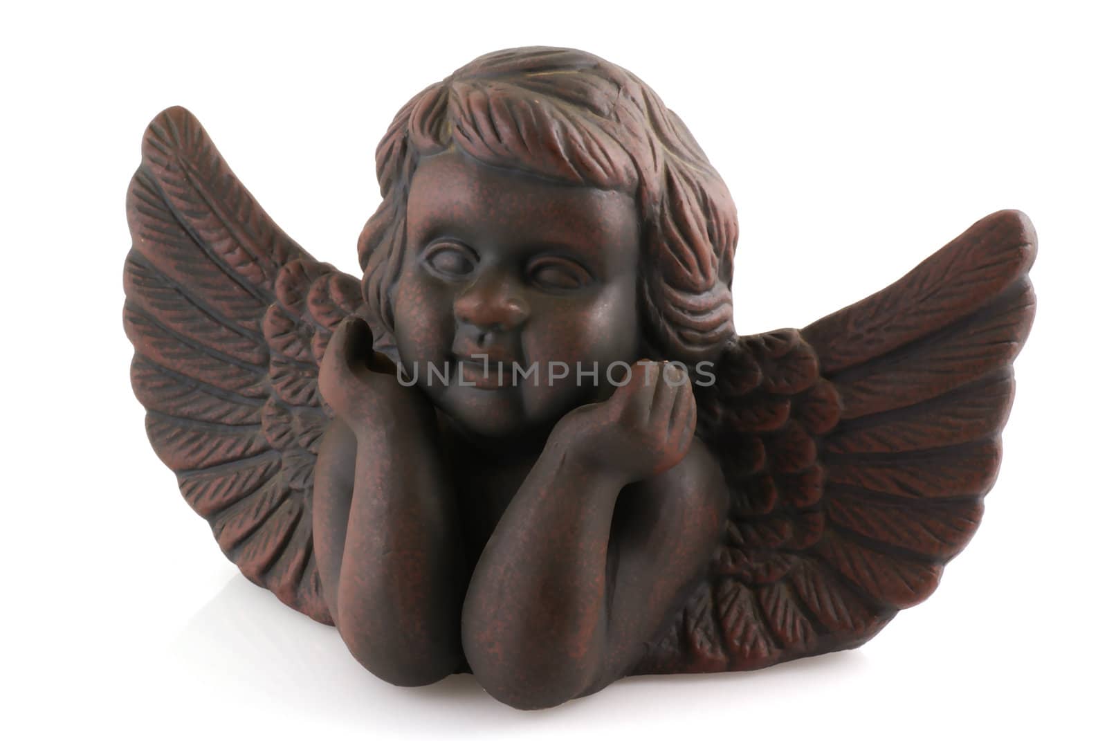 Little brown angel in dreamy atmosphere; isolated on white.                