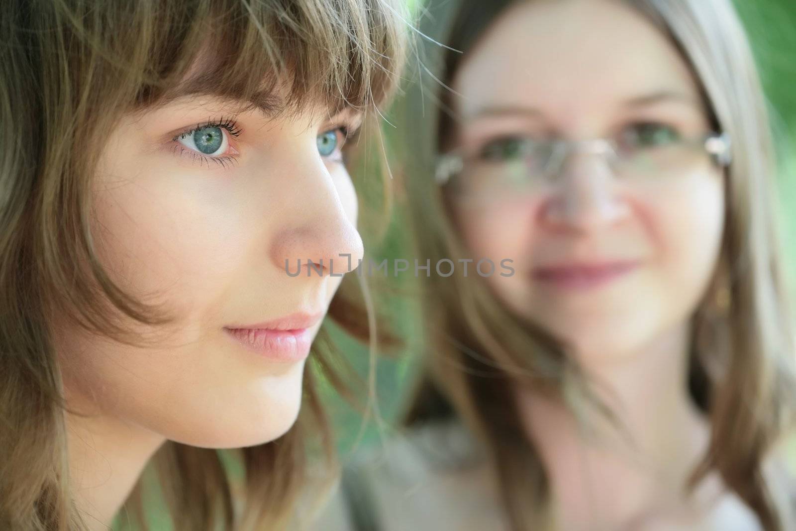close-up portrait of the two young and beautiful girls