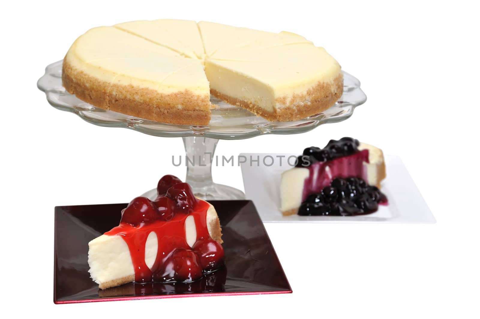 Strawberry and blueberry cheesecake isolated on white background with clipping path.
