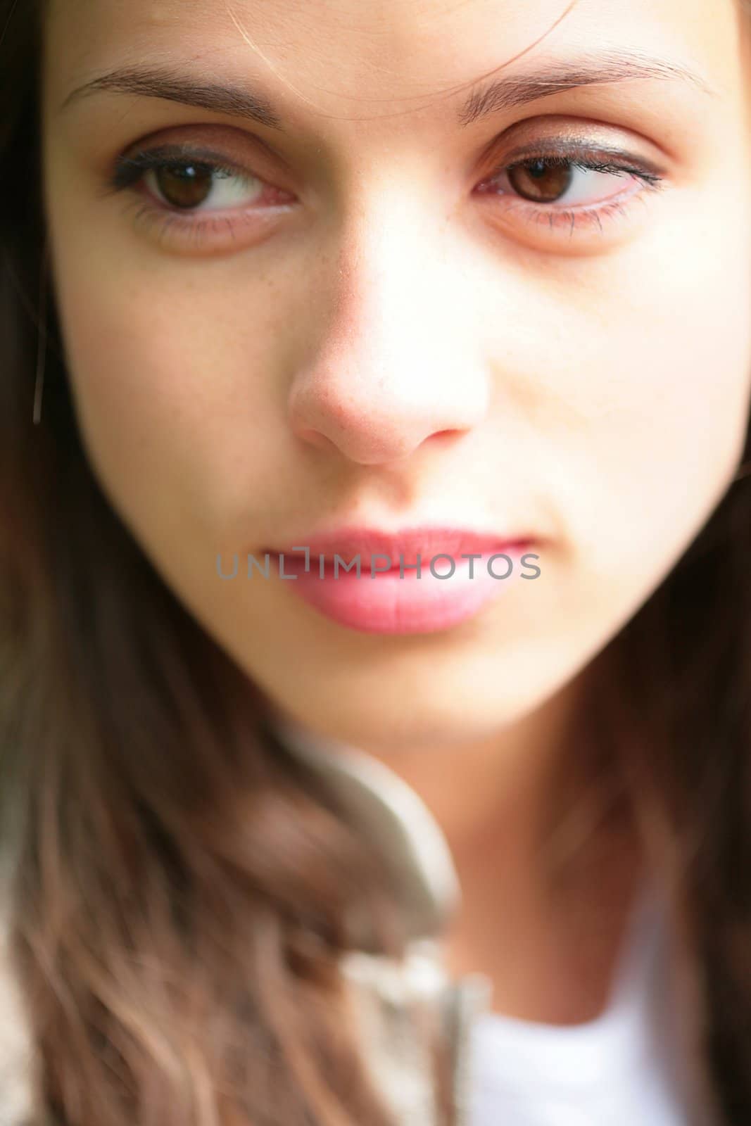 close-up portrait of the beautiful young girl with brown eye