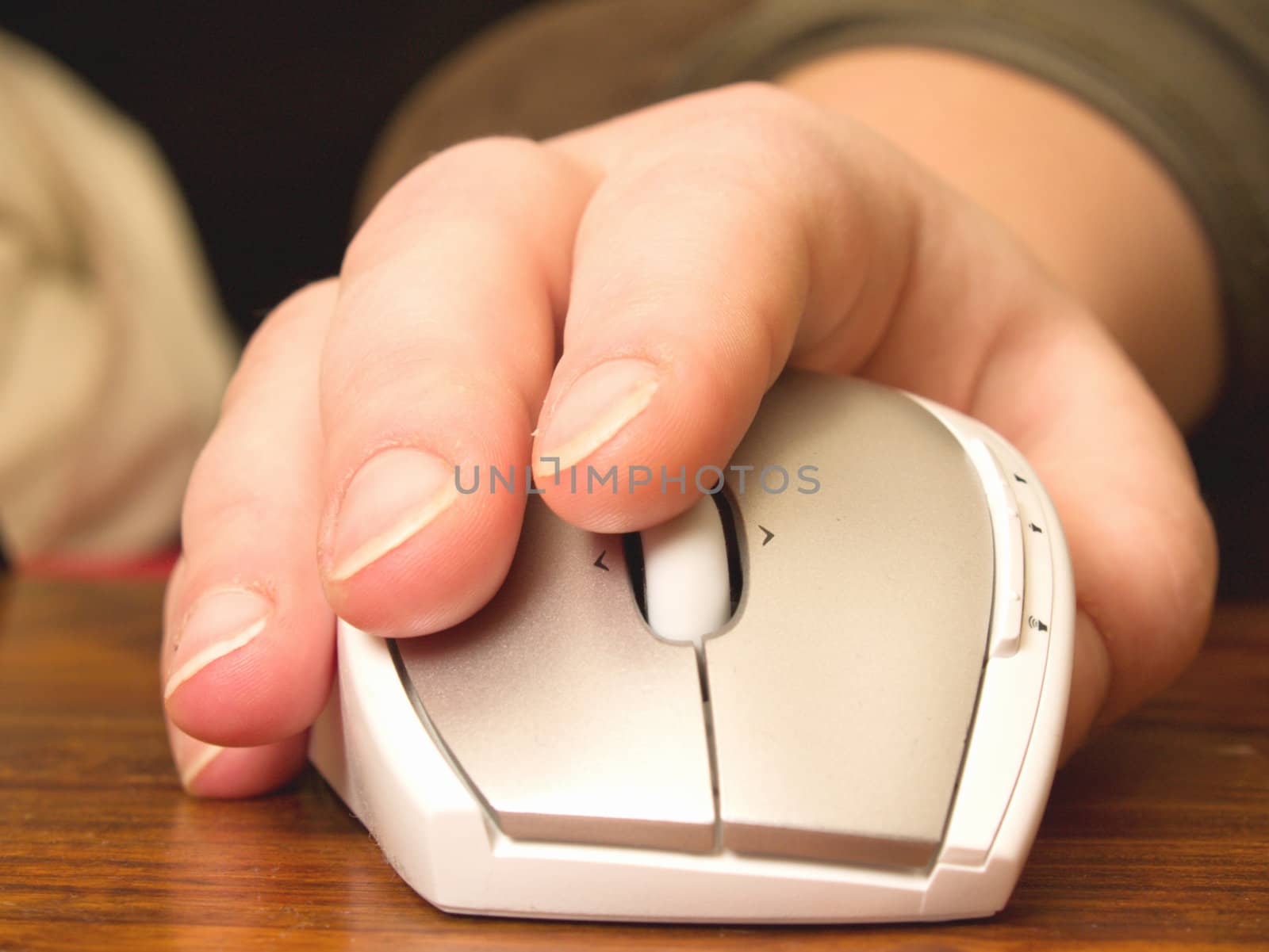 Business concept - Hand using computer mouse on wooden  table