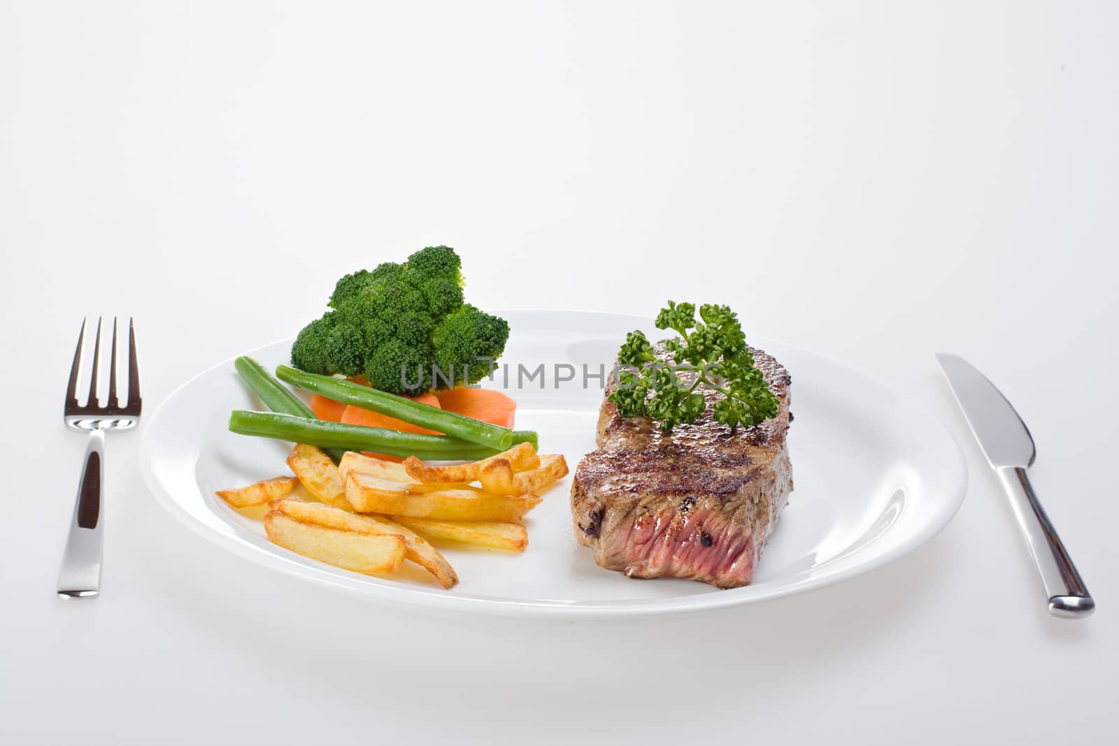 grilled steak on a plate with fries by bernjuer