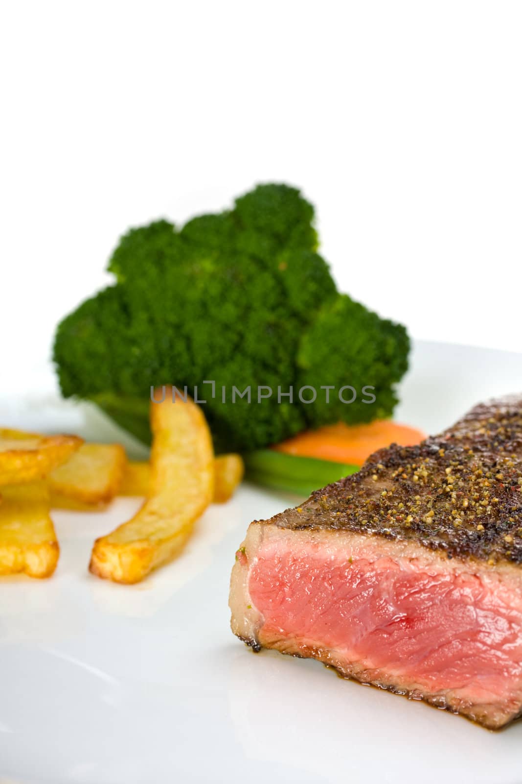 grilled steak on a plate with fries by bernjuer