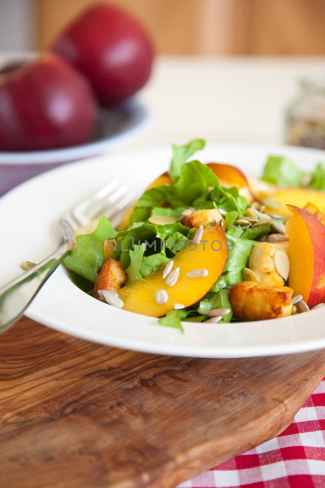 Healthy and delicious salad with endive, haloumi and nectarines