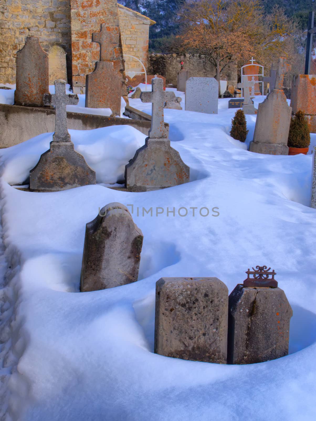 Graves of the provence cemetery of Vergons in the snow