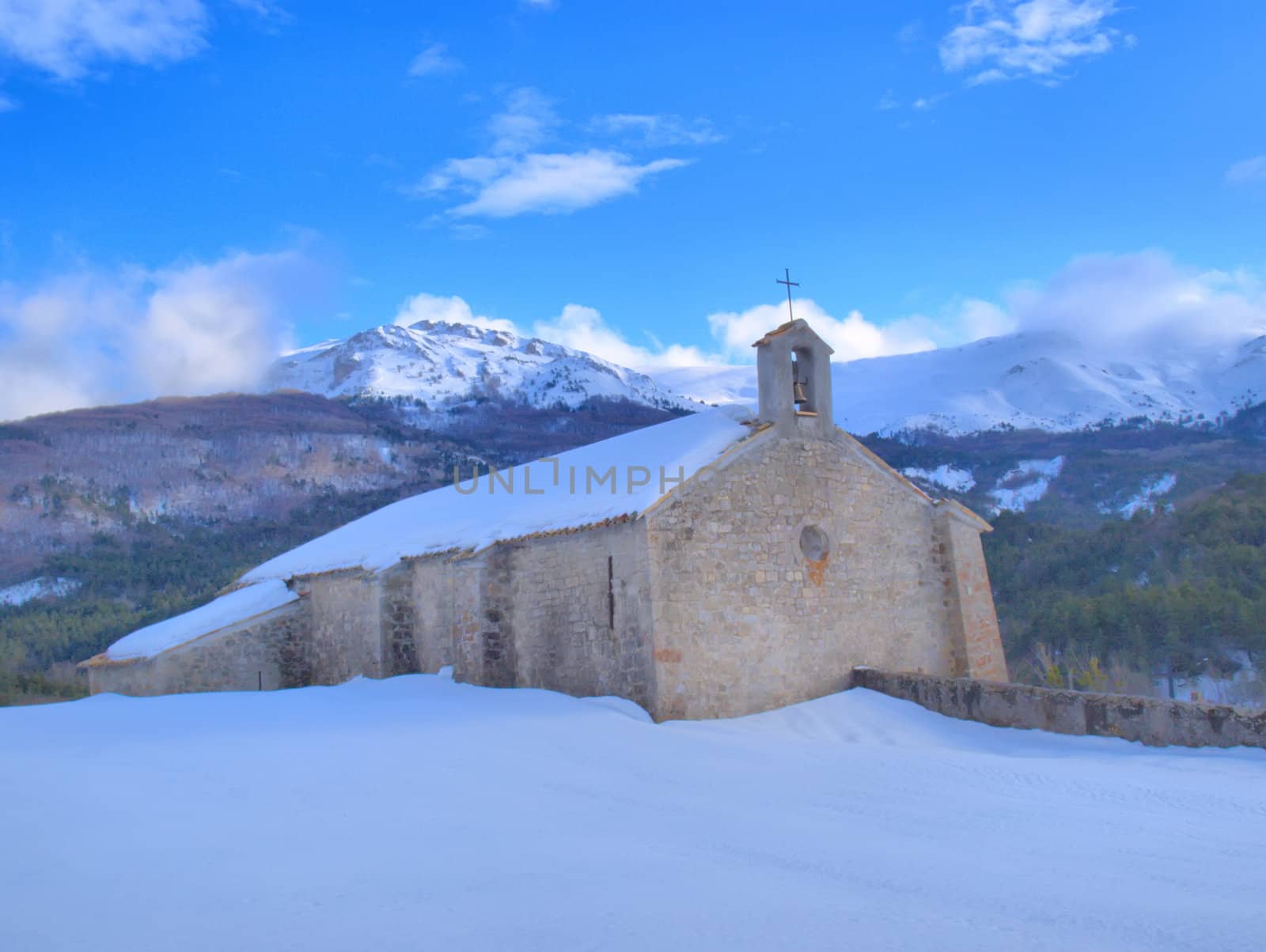 Provence chapel in a snowy landscape by jbouzou