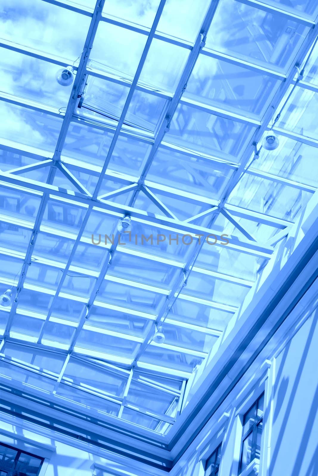 abstraction, sky with cloud through blue glass transparent ceiling