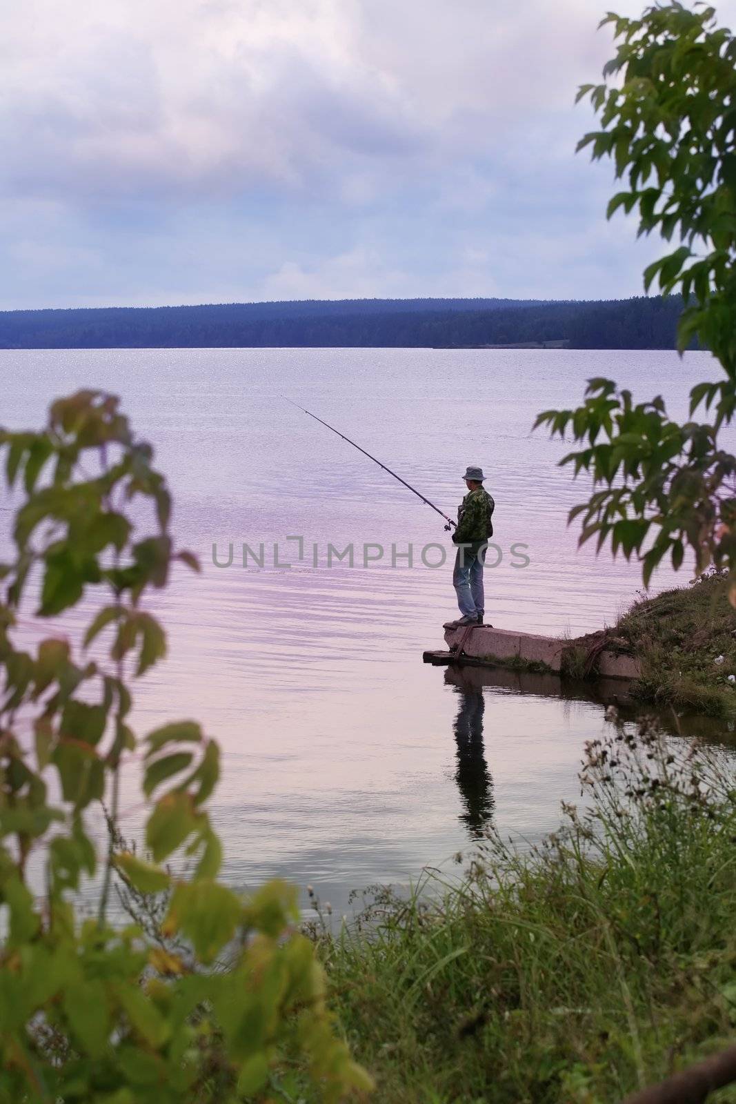 Middle Ural, blue twilight on fishing, fisherman