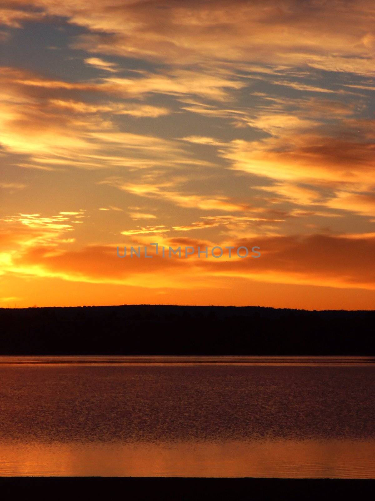 Orange sunrise and lakefront by jdebordphoto