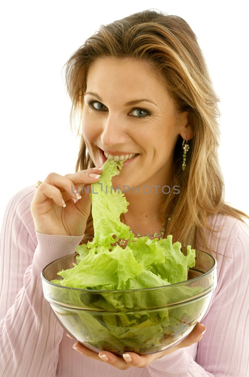 attractive caucasian woman eating lettuce