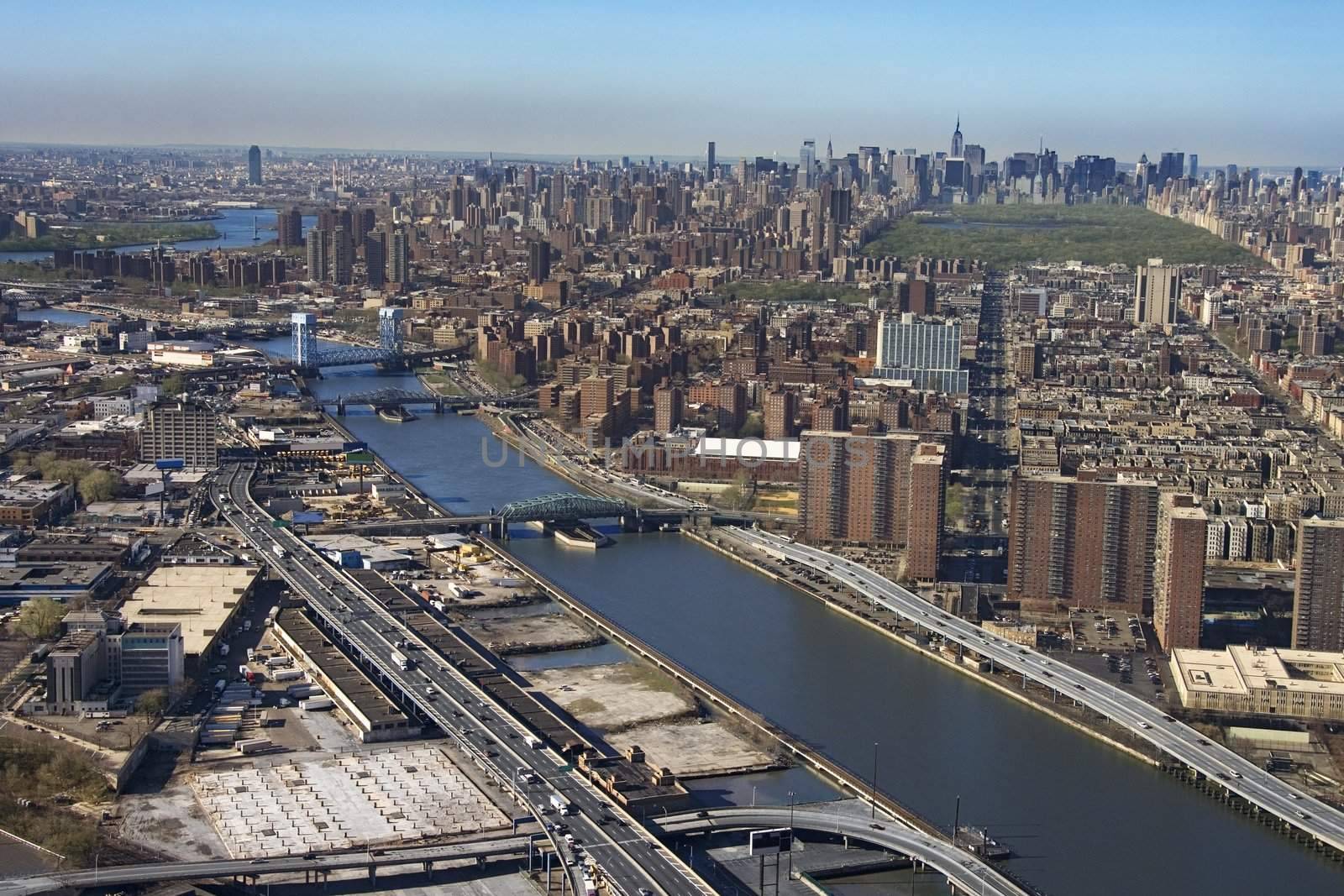 Aerial view of Harlem River and bridges with the Bronx and Manhattan buildings in New York City.